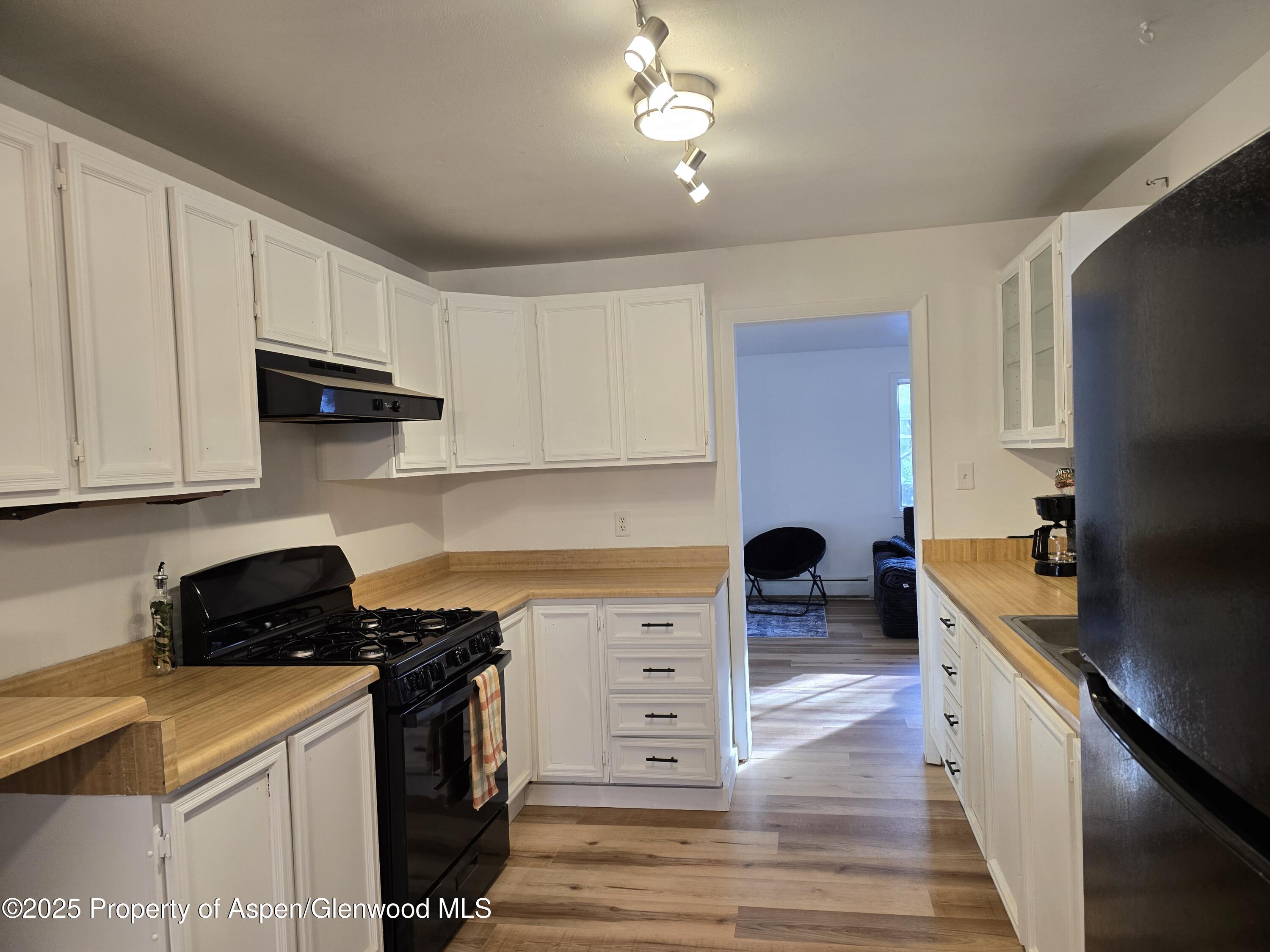 770 School Street Craig, CO 81625 - Photo 5 of 19 a kitchen with stainless steel appliances a stove a sink and a refrigerator