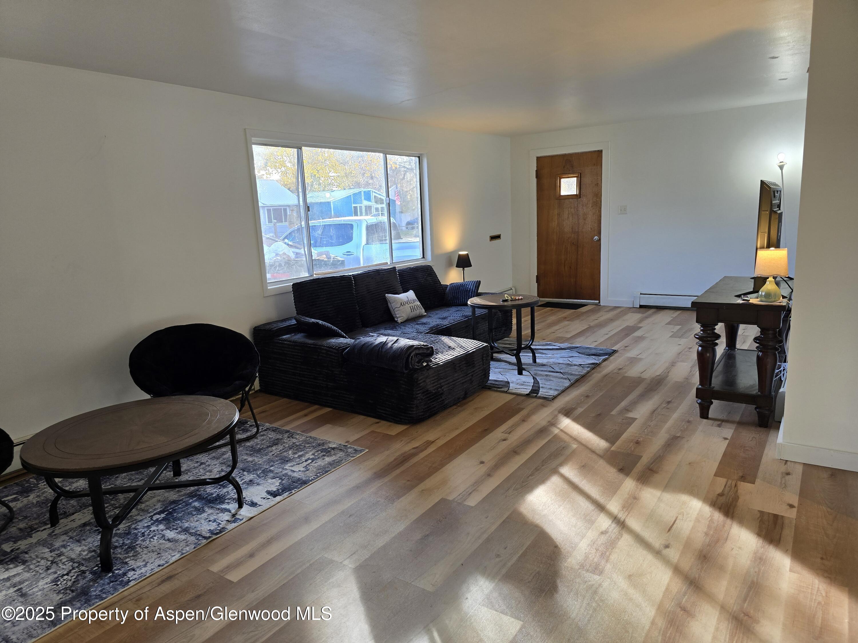 770 School Street Craig, CO 81625 - Photo 9 of 19 a living room with furniture and a window