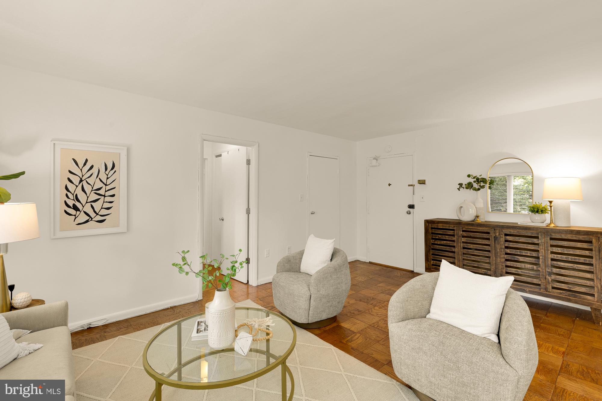 2400 41st Street Northwest, Unit 212 Washington, DC 20007 - Photo 4 of 24 a living room with furniture and a lamp