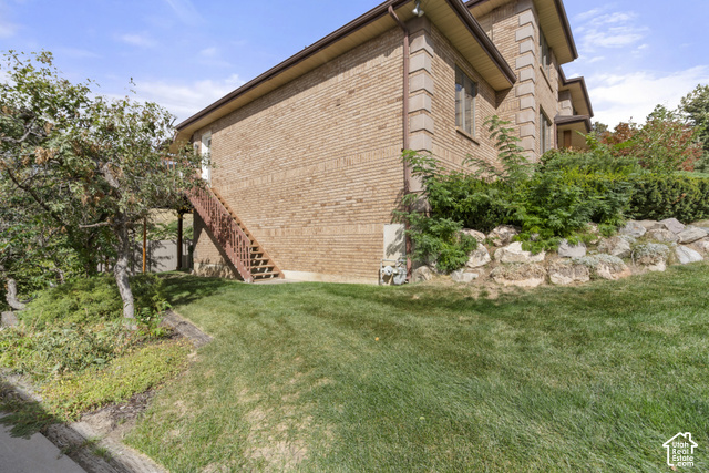 1373 Pheasant Ridge Circle Bountiful, UT 84010 - Photo 43 of 50 Brick exterior with stone accents and a sloped lawn