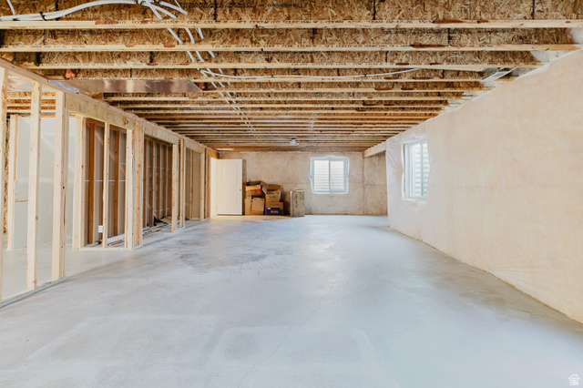 433 North 600 West Smithfield, UT 84335 - Photo 38 of 40 Unfinished basement presenting framed walls, concrete flooring, exposed ceiling joists, and multiple windows