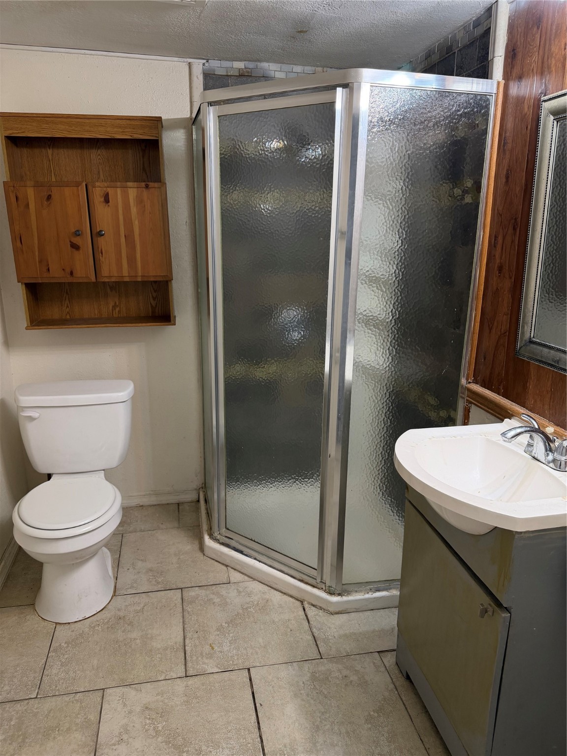323 Reppert Street Bacliff, TX 77518 - Photo 4 of 8 a bathroom with a toilet a sink and a shower
