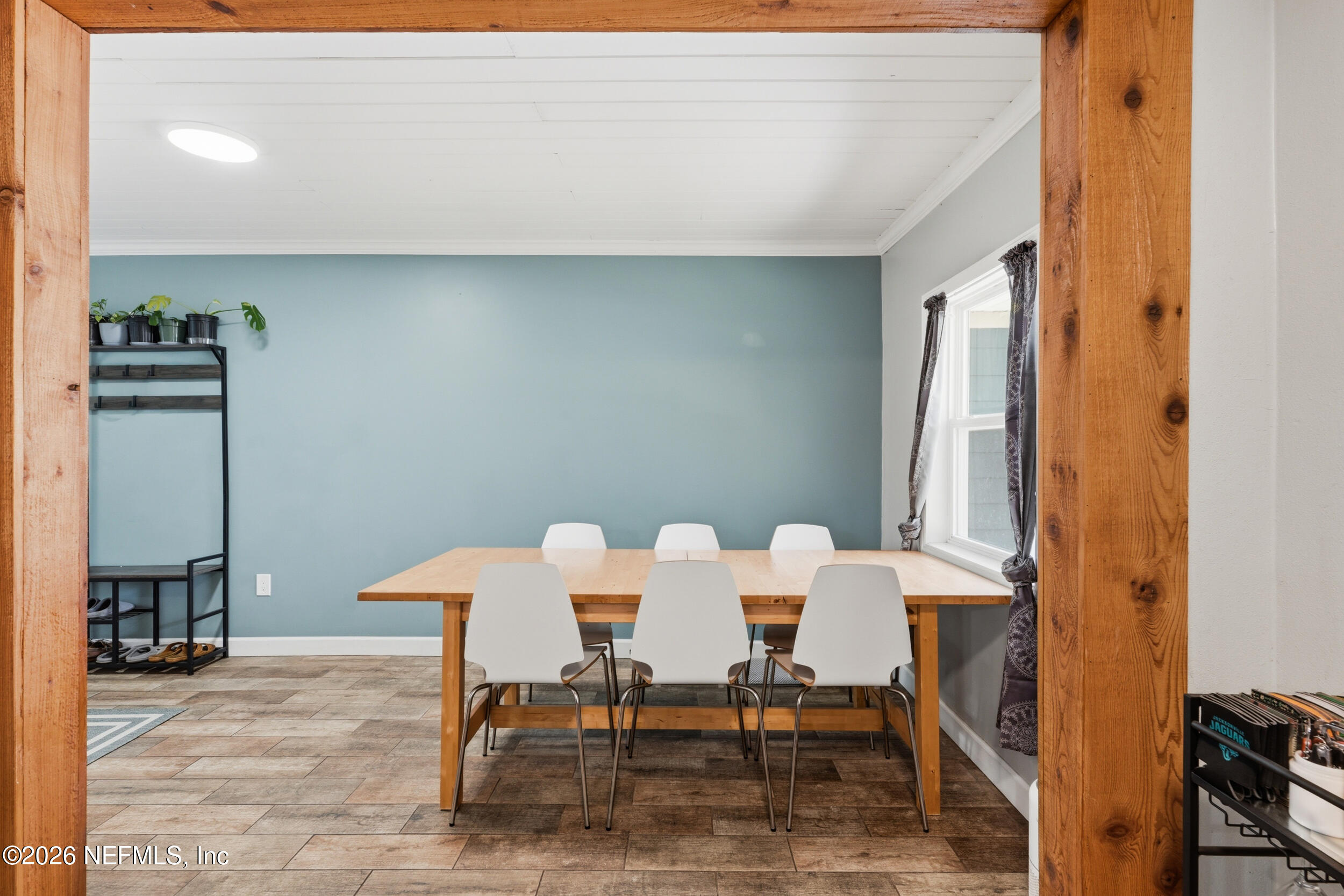 2032 Inwood Terrace Jacksonville, FL 32207 - Photo 11 of 27 a dining room with furniture and a window