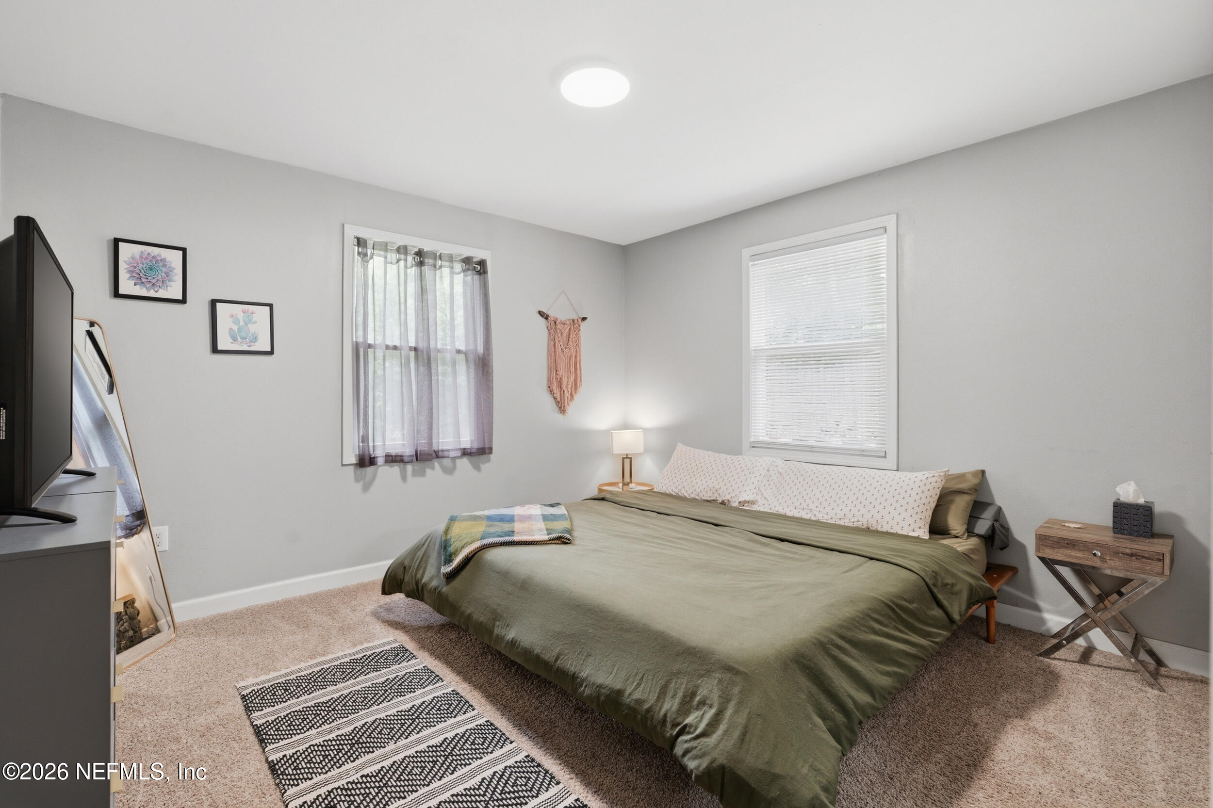 2032 Inwood Terrace Jacksonville, FL 32207 - Photo 13 of 27 a bedroom with a bed and a window