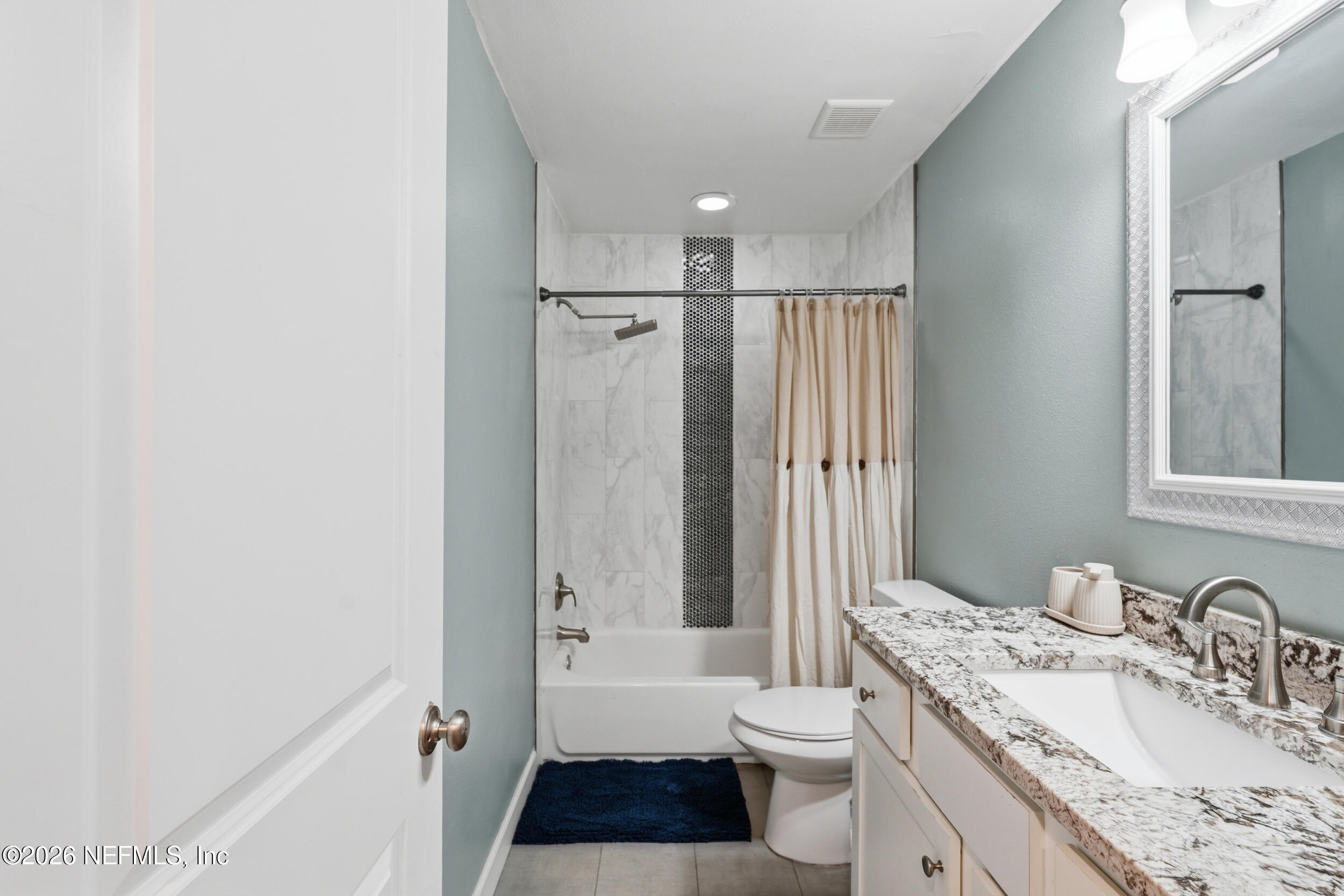 2032 Inwood Terrace Jacksonville, FL 32207 - Photo 17 of 27 a bathroom with a granite countertop sink toilet and shower