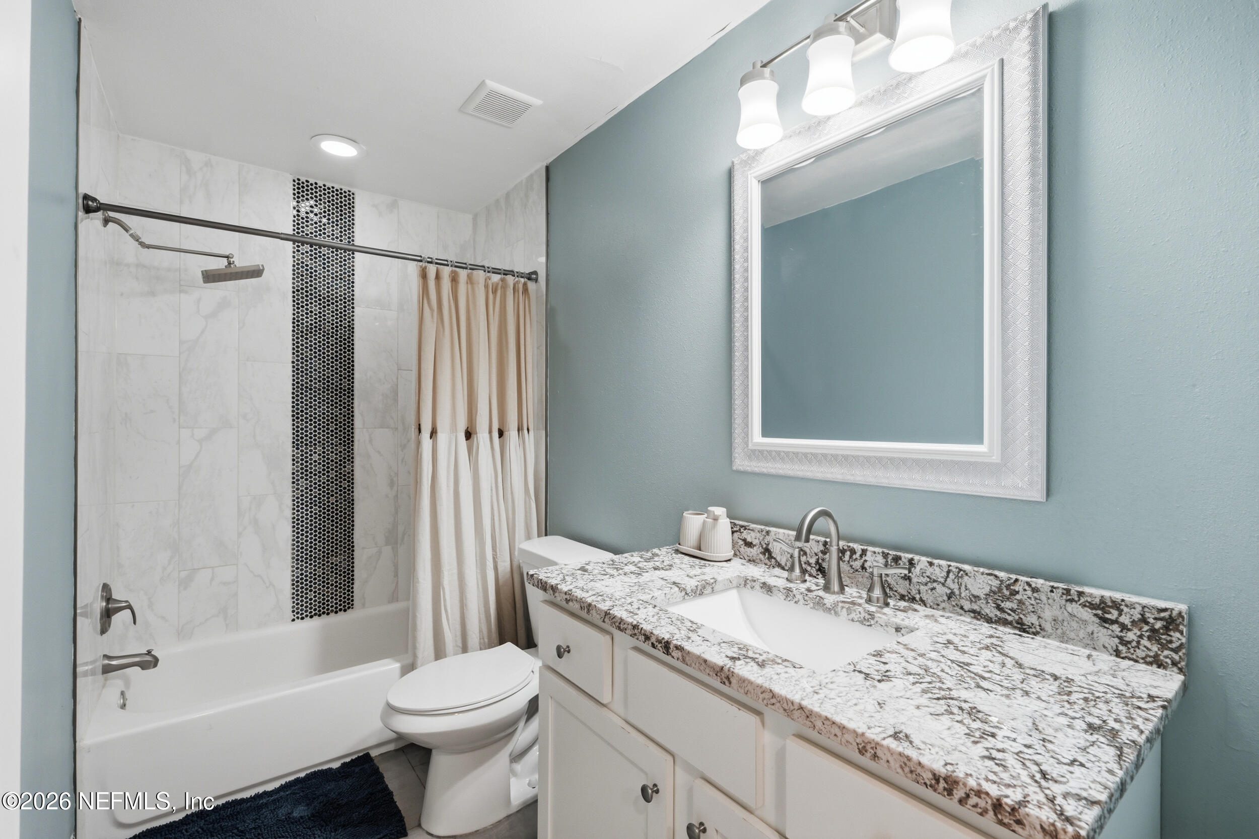 2032 Inwood Terrace Jacksonville, FL 32207 - Photo 18 of 27 a bathroom with a granite countertop sink toilet and shower
