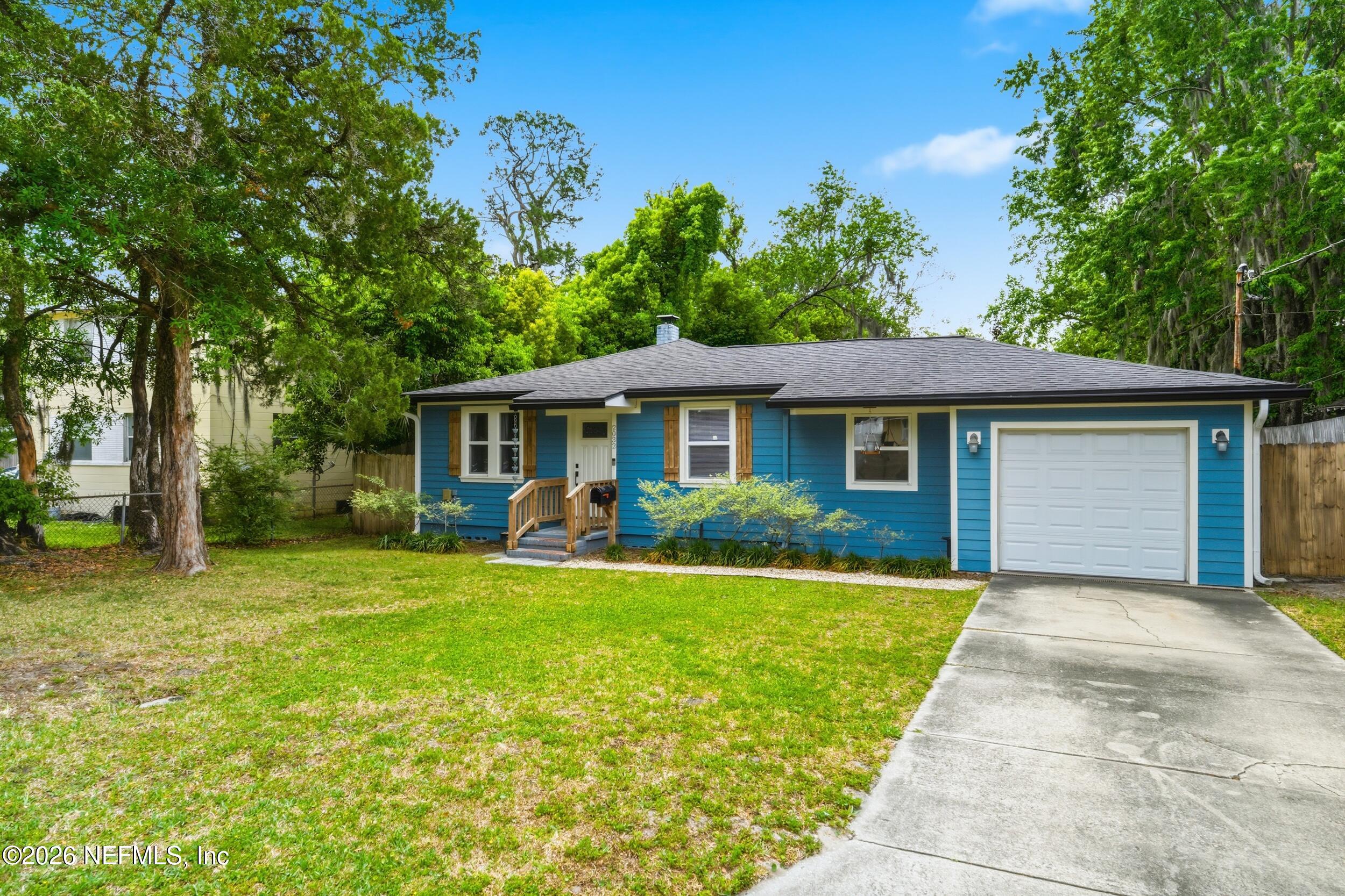 2032 Inwood Terrace Jacksonville, FL 32207 - Photo 2 of 27 a front view of a house with a yard