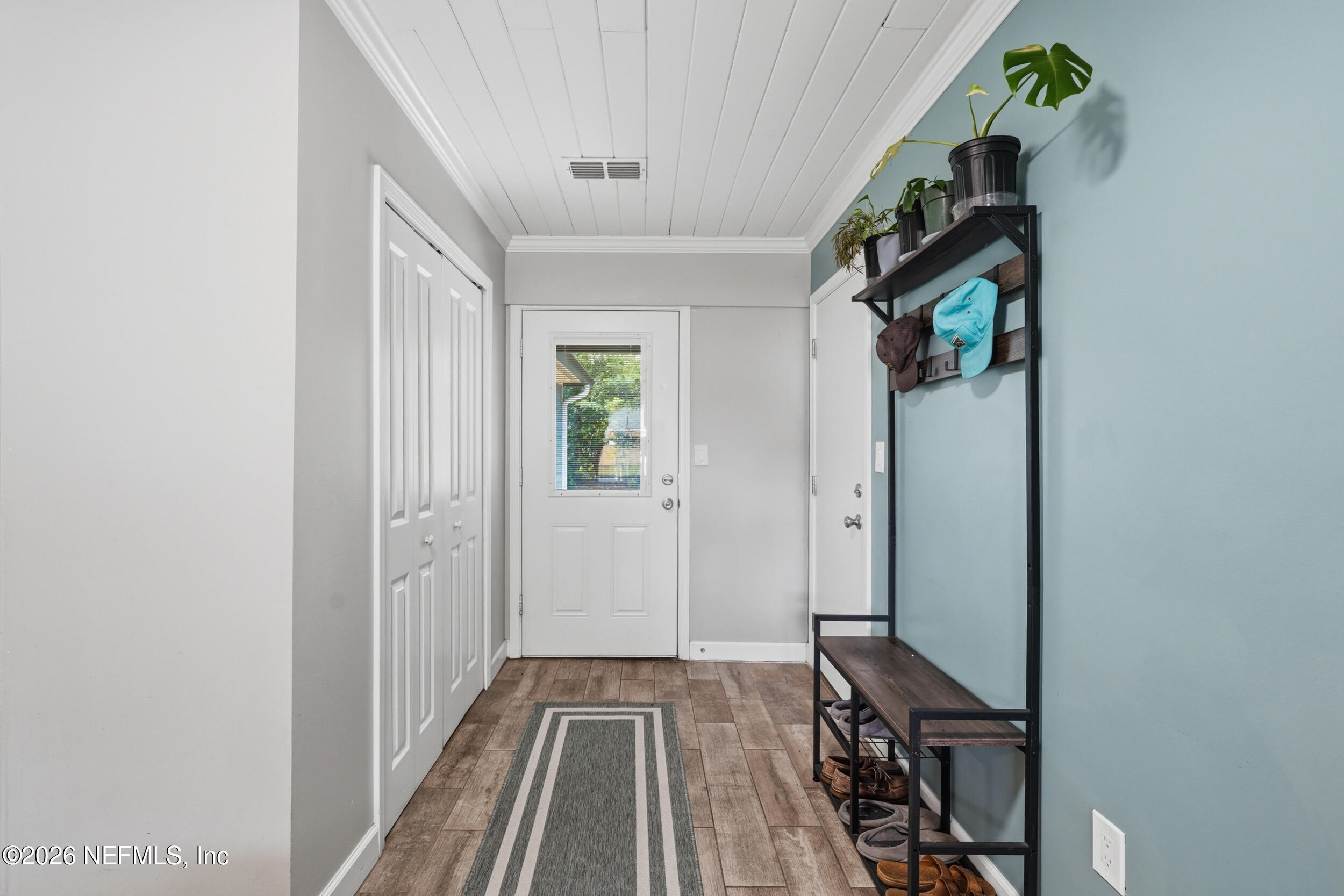 2032 Inwood Terrace Jacksonville, FL 32207 - Photo 4 of 27 a view of a hallway with wooden floor and entryway