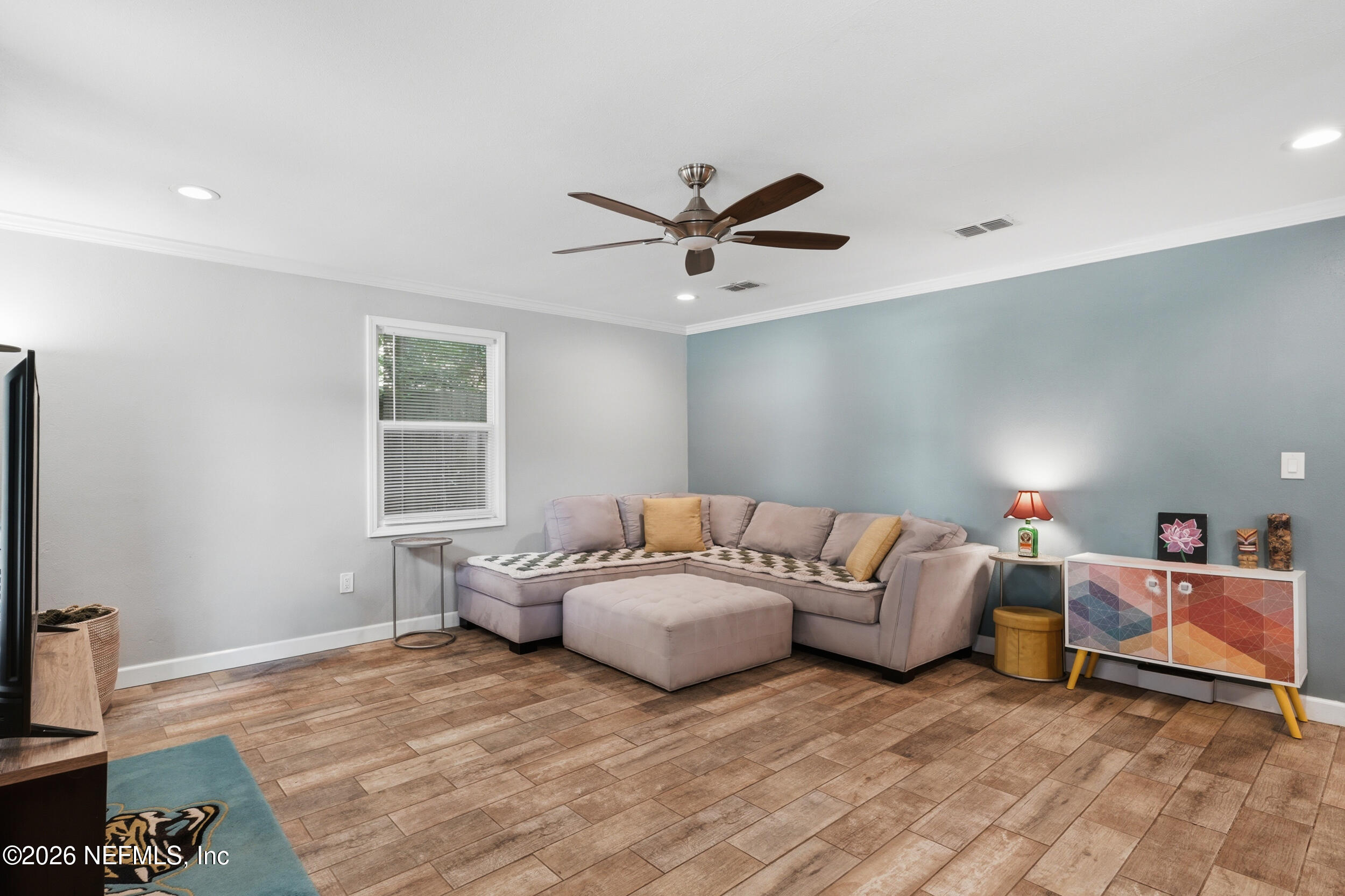 2032 Inwood Terrace Jacksonville, FL 32207 - Photo 6 of 27 a living room with furniture and a ceiling fan