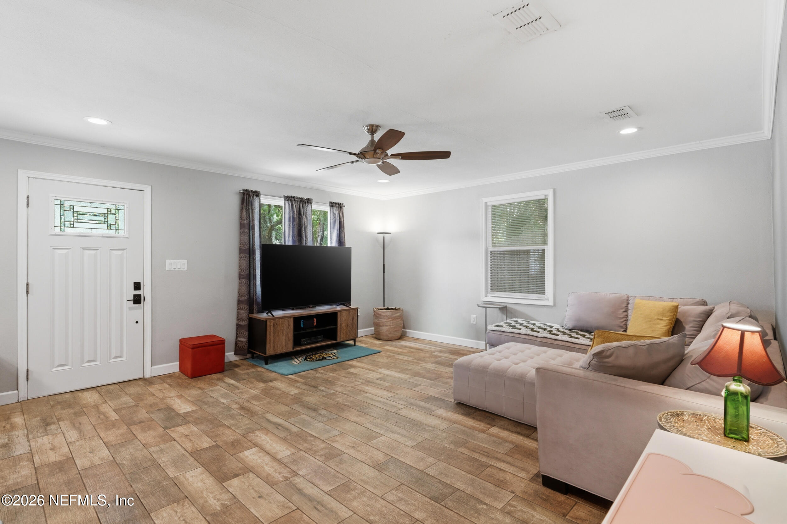 2032 Inwood Terrace Jacksonville, FL 32207 - Photo 7 of 27 a bedroom with a bed and a flat screen tv