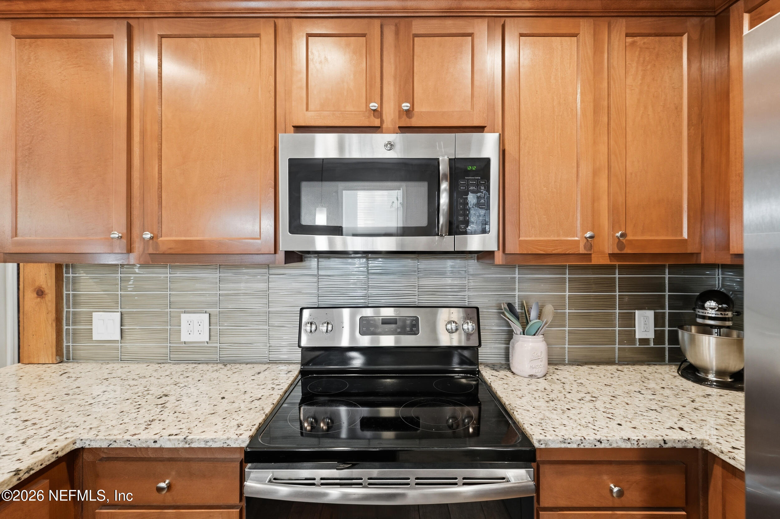 2032 Inwood Terrace Jacksonville, FL 32207 - Photo 10 of 27 a kitchen with granite countertop cabinets and steel stainless steel stove
