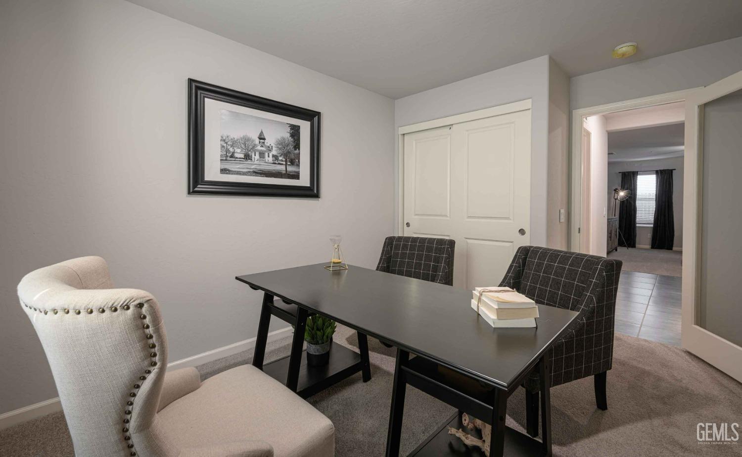 Undisclosed Address Bakersfield, CA 93313 - Photo 18 of 21 a view of a dining room with furniture and wooden floor
