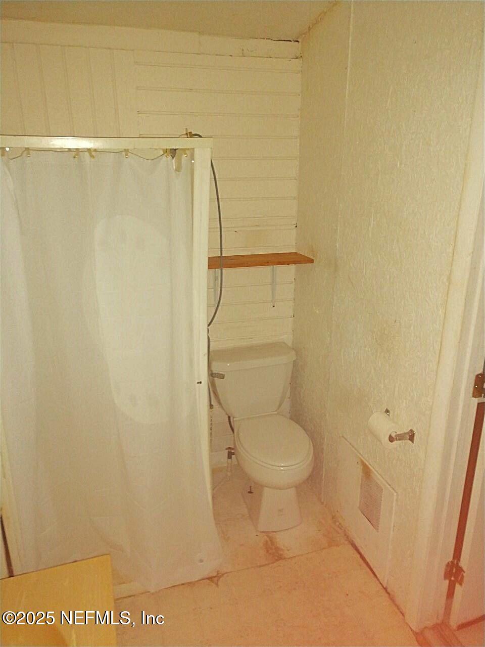 799 Roberts Aman Road Perry, FL 32347 - Photo 4 of 13 a bathroom with a toilet and a shower