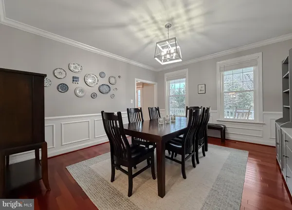 a living room with furniture and a view of kitchen
