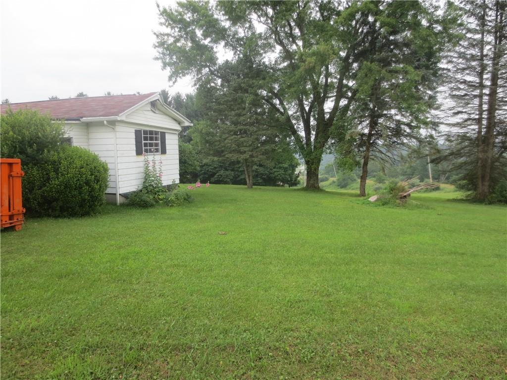 50 Hodell Road Armagh, PA 15920 - Photo 14 of 15 a yellow house with a garden