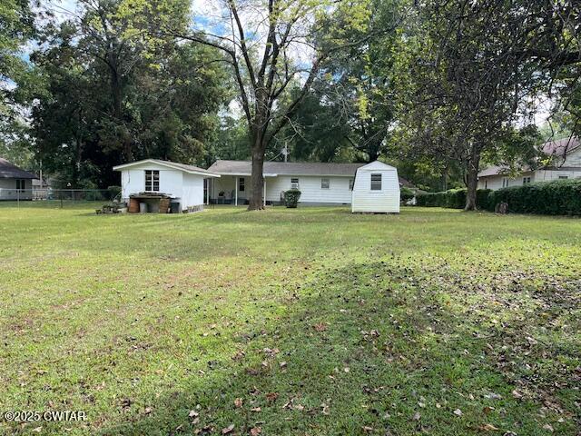 2000 Culpepper Street Milan, TN 38358 - Photo 13 of 13 a front view of a house with a yard and trees