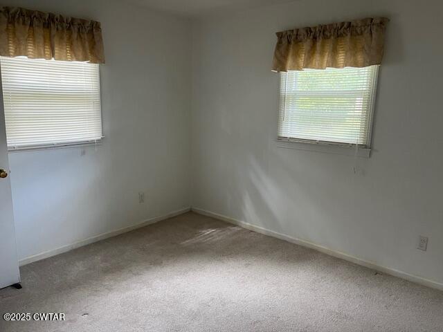 2000 Culpepper Street Milan, TN 38358 - Photo 5 of 13 an empty room with a window