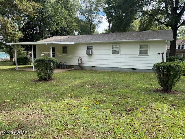 2000 Culpepper Street Milan, TN 38358 - Photo 10 of 13 a backyard of a house with yard table and chairs