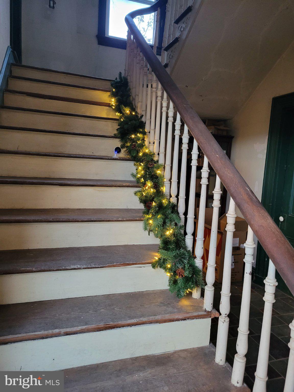 22109 Aquasco Road Aquasco, MD 20608 - Photo 28 of 34 Festive staircase adorned with lights.