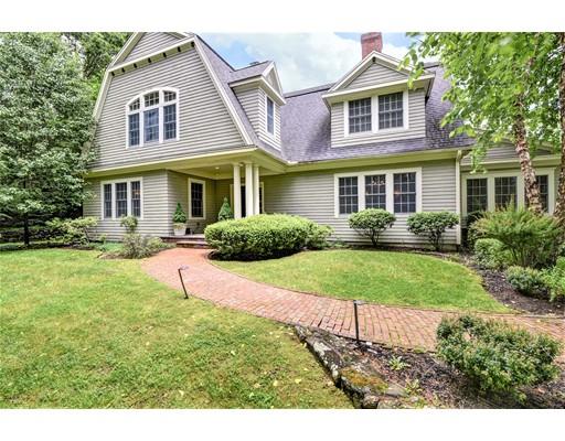 24 Stonefield Court Needham, MA 02492 - Photo 1 of 42 a front view of a house with garden and porch