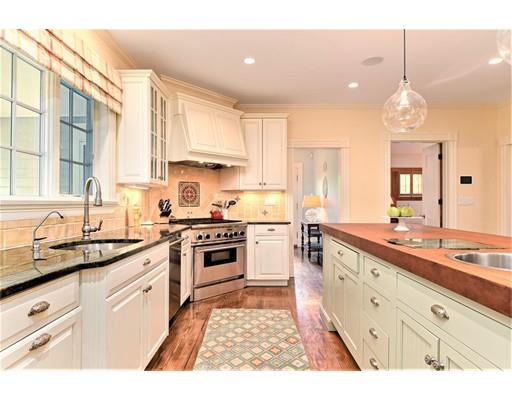 24 Stonefield Court Needham, MA 02492 - Photo 14 of 42 a kitchen with a sink stove and cabinets