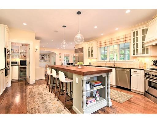 24 Stonefield Court Needham, MA 02492 - Photo 15 of 42 a large kitchen with a table and chairs