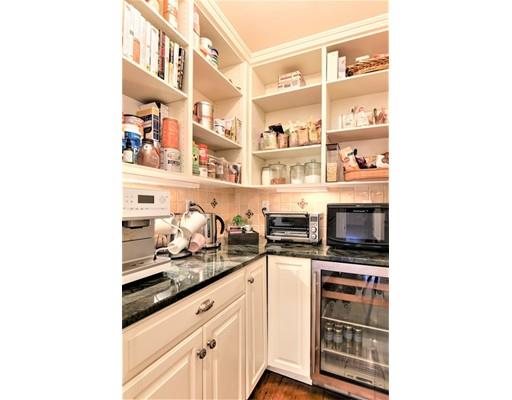 24 Stonefield Court Needham, MA 02492 - Photo 17 of 42 a kitchen with stainless steel appliances a cabinets and stove top oven