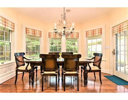 24 Stonefield Court Needham, MA 02492 - Photo 18 of 42 a dining room with furniture and wooden floor