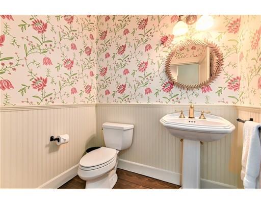 24 Stonefield Court Needham, MA 02492 - Photo 21 of 42 a bathroom with a sink mirror vanity and toilet