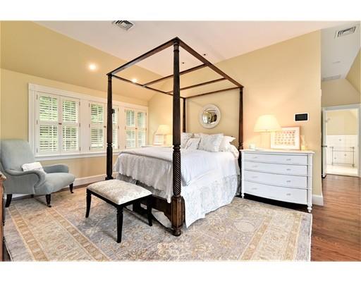 24 Stonefield Court Needham, MA 02492 - Photo 22 of 42 a spacious bedroom with a bed a couch and large window