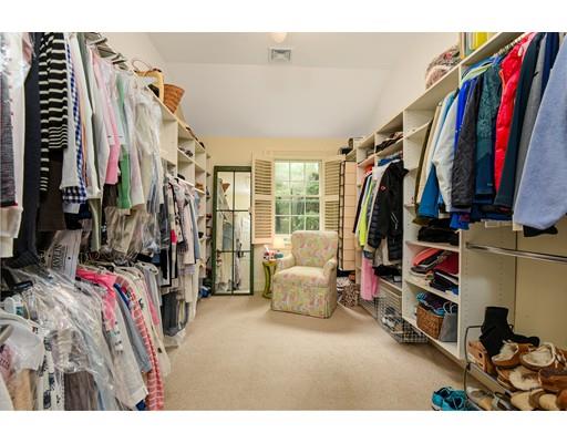 24 Stonefield Court Needham, MA 02492 - Photo 23 of 42 a view of walk in closet with clothes and shoes