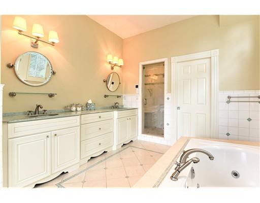 24 Stonefield Court Needham, MA 02492 - Photo 24 of 42 a spacious bathroom with a tub sink and mirror