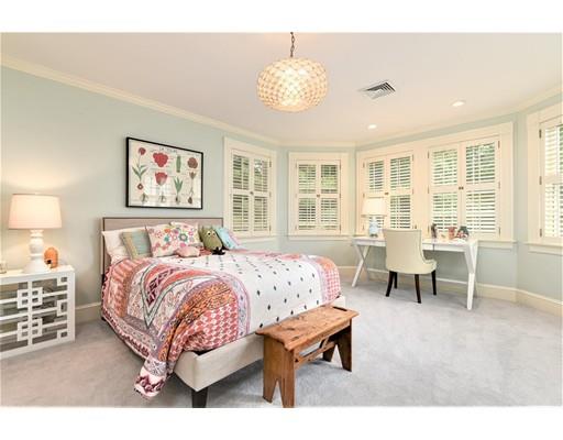 24 Stonefield Court Needham, MA 02492 - Photo 27 of 42 a spacious bedroom with a bed and a chandelier