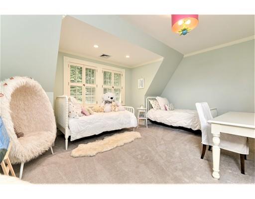 24 Stonefield Court Needham, MA 02492 - Photo 28 of 42 a bedroom with a bed and a chair