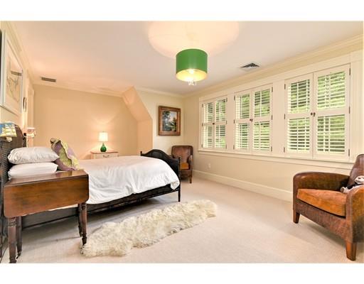 24 Stonefield Court Needham, MA 02492 - Photo 30 of 42 a spacious bedroom with a bed and a couch