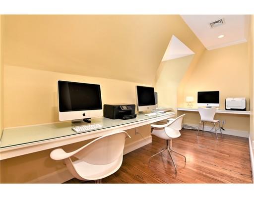 24 Stonefield Court Needham, MA 02492 - Photo 34 of 42 a view of a workspace with furniture and a flat screen tv