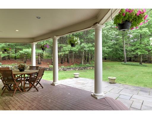 24 Stonefield Court Needham, MA 02492 - Photo 41 of 42 a view of a porch with chairs and backyard