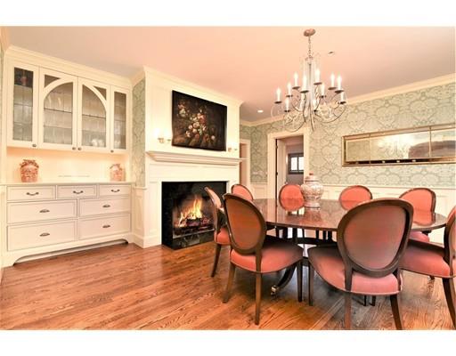 24 Stonefield Court Needham, MA 02492 - Photo 9 of 42 a dining room with furniture a fireplace and wooden floor