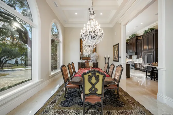 a view of a dining room with furniture window and outside view