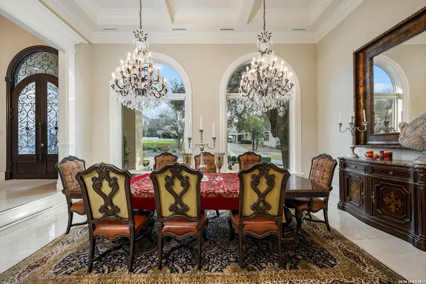 a large kitchen with a table and chairs