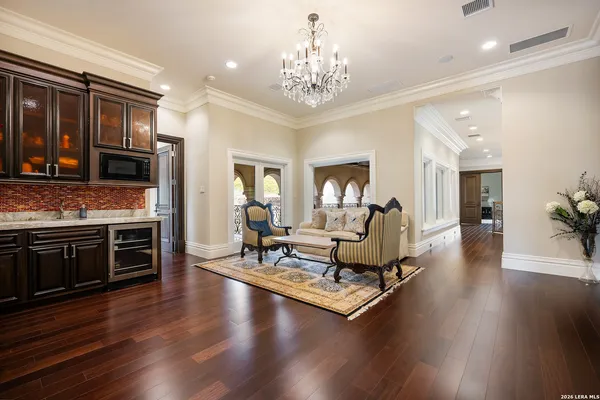 a living room with furniture flat screen tv and a table