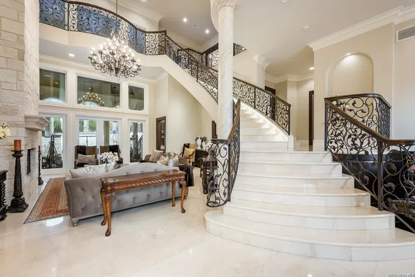 a view of entryway with hall and lots of frames on wall