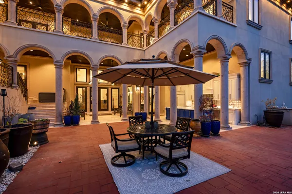a view of a chairs and tables in the patio