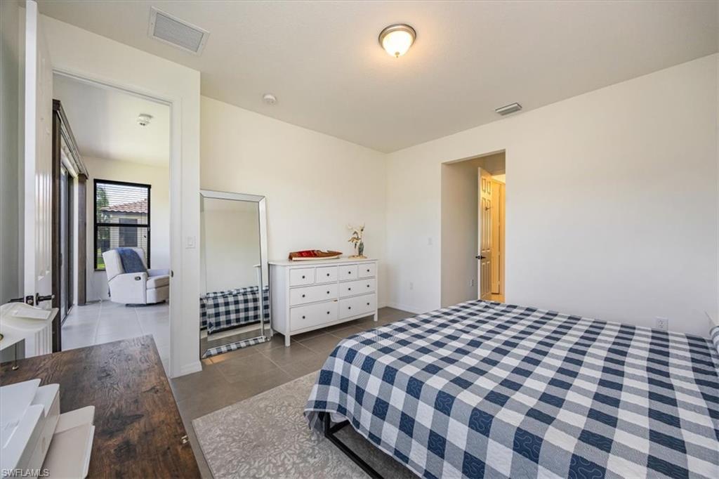 5547 Useppa Drive Ave Maria, FL 34142 - Photo 11 of 33 Tiled bedroom featuring visible vents