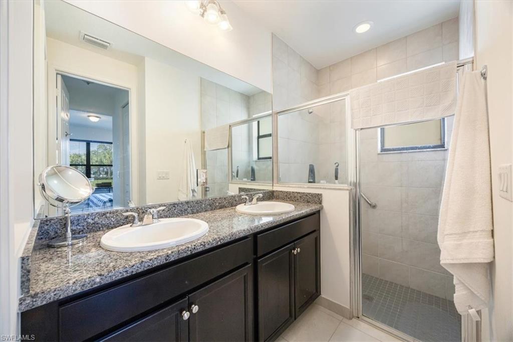 5547 Useppa Drive Ave Maria, FL 34142 - Photo 12 of 33 Full bath featuring visible vents, a shower stall, and a sink