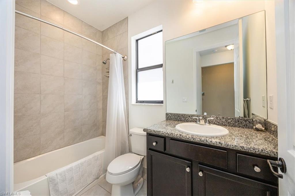 5547 Useppa Drive Ave Maria, FL 34142 - Photo 13 of 33 Full bath featuring vanity, toilet, and shower / tub combo