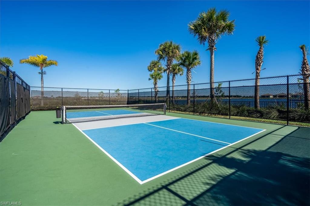 5547 Useppa Drive Ave Maria, FL 34142 - Photo 25 of 33 View of tennis court featuring fence