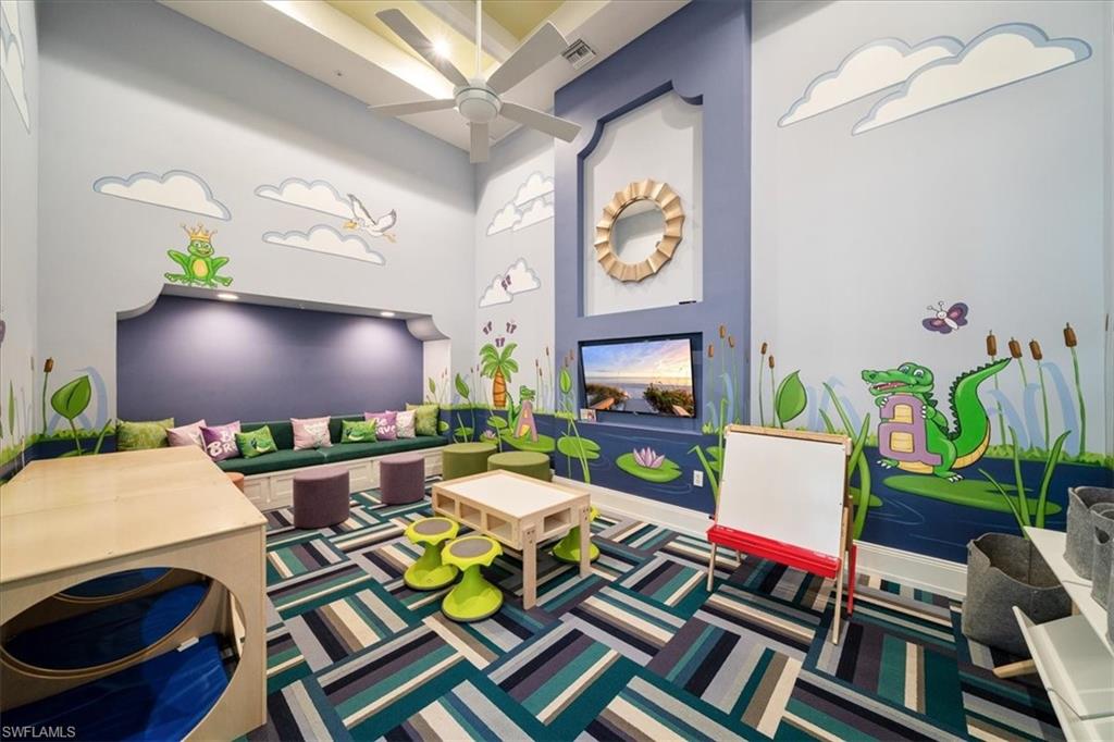 5547 Useppa Drive Ave Maria, FL 34142 - Photo 33 of 33 Game room with a towering ceiling, carpet, a ceiling fan, and visible vents