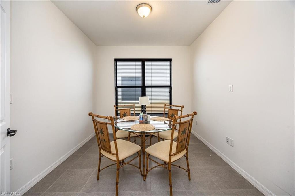 5547 Useppa Drive Ave Maria, FL 34142 - Photo 9 of 33 Tiled dining room with baseboards