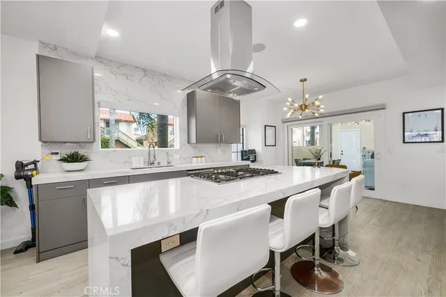 a kitchen with a dining table and chairs